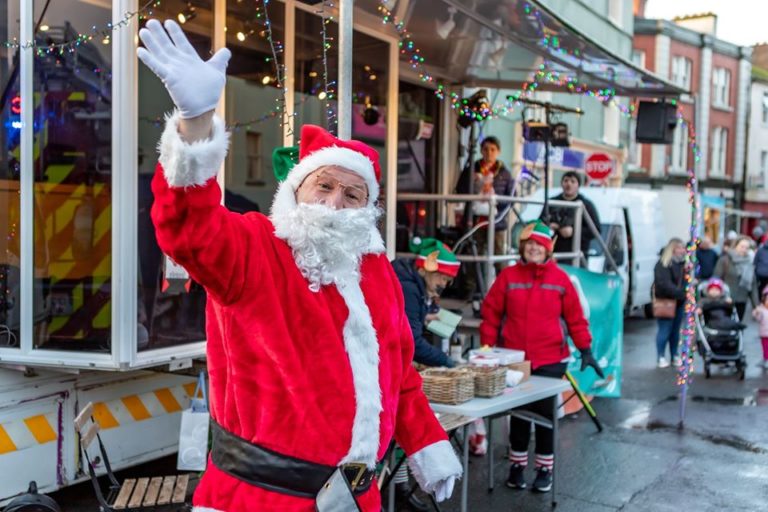 Santa at Elf Parade with OB Unit in Background 768x512